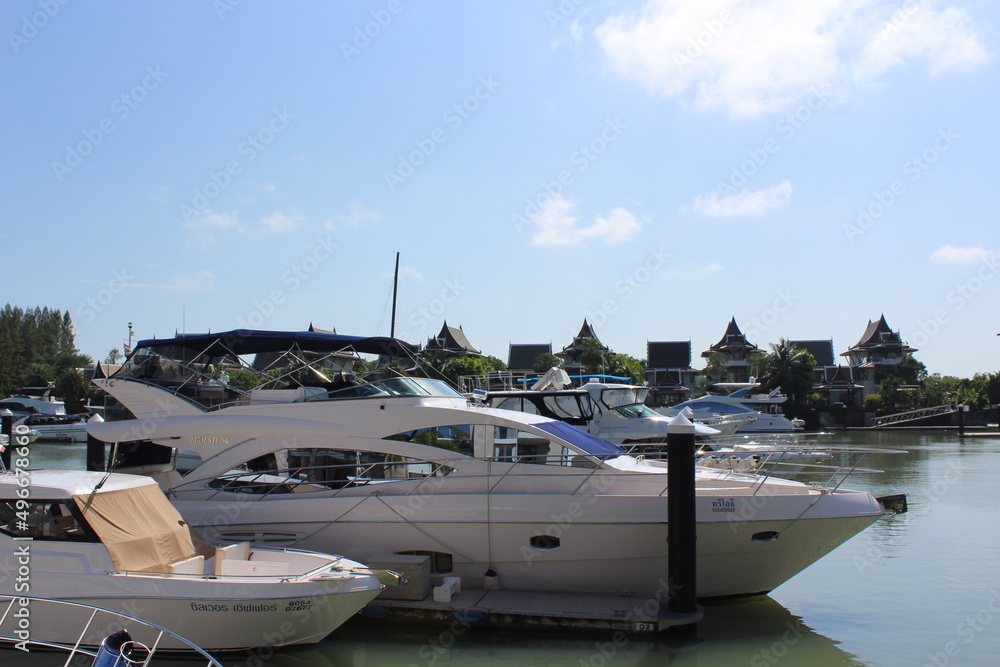 Fototapeta premium Big white motorboats parked in marina open from the top.