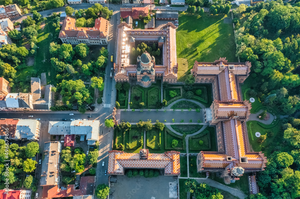 Aerial view of Yuriy Fedkovych National University, Seminar Residence and Church of the Three Hierarchs. Old historical university building with towers, domes and green garden Chernivtsi, Ukraine
