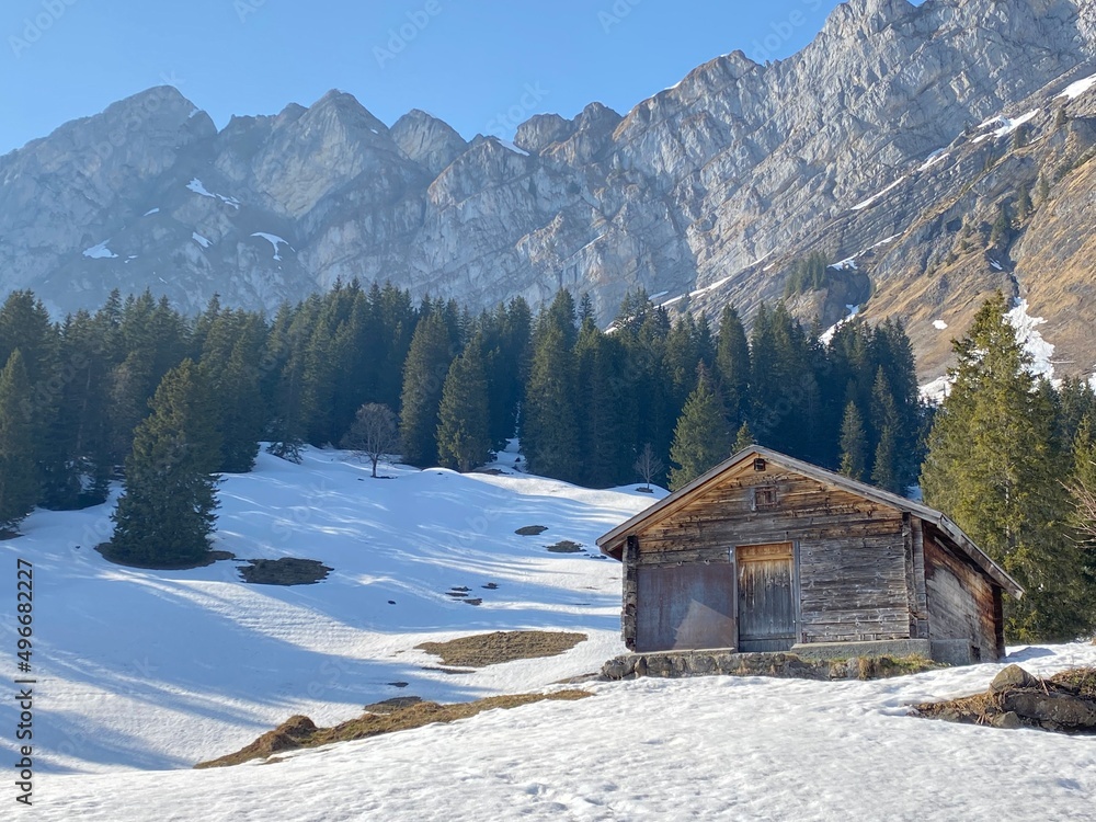 Mountain huts (chalets) or farmhouses and old wooden cattle houses in the alpine valley of Klöntal (or Kloental) and by the resevoir lake Klöntalersee (Kloentalersee) - Canton of Glarus, Switzerland