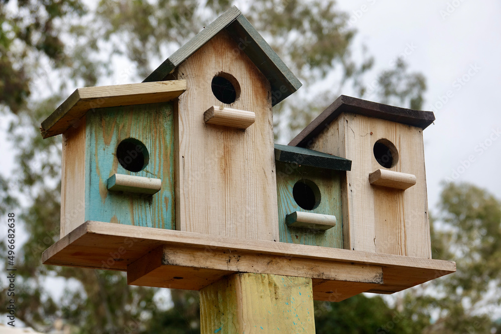 group of birdhouses on a post group of birdhouses on a post