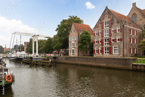 Old canal houses and pedestrian drawbridge over the Thorbeckegracht in the center of Zwolle.