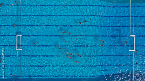 Foto Aerial drone top down photo of water polo tournament as seen in huge pool