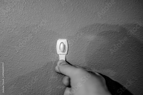 Selective focus on adhesive strip wall hanger that can be removed by pulling tape photo