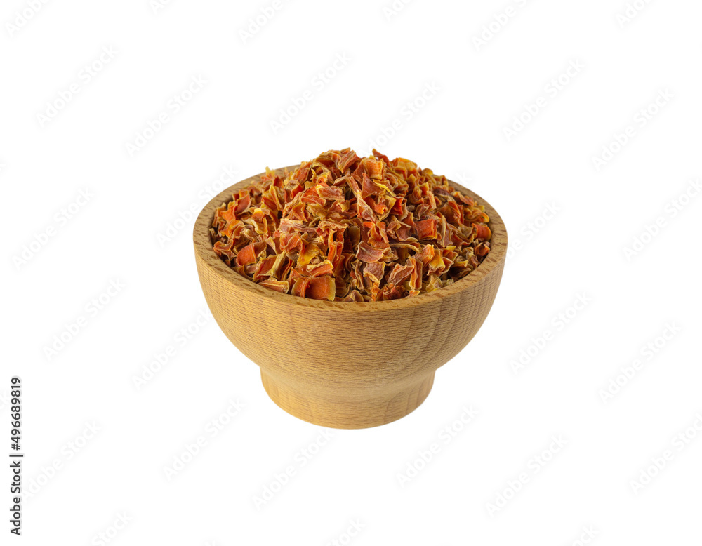 dried carrot pieces in wooden bowl isolated on white background. Spices and food ingredients. dried carrot pieces in wooden bowl isolated on white background. Spices and food ingredients.
