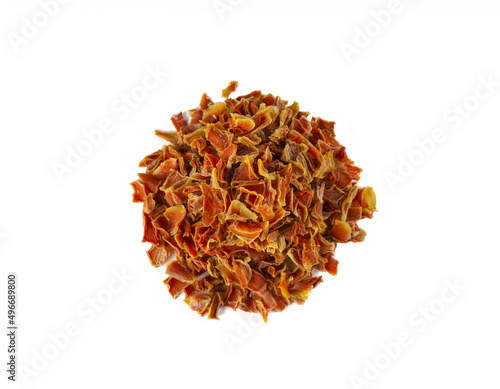 dried carrot pieces heap isolated on white background. Spices and food ingredients.