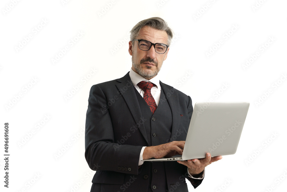 Portrait of Caucasian businessman look confident like a boss holding laptop and look toward to camera, isolated over white background. Portrait of Caucasian businessman look confident like a boss holding laptop and look toward to camera, isolated over white background.
