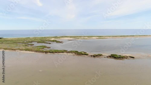 Aerial panning around shallow inlet in Cape Cod Bay Massachussettes  photo