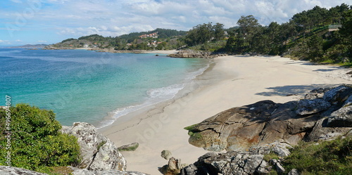 Coastline with sandy beach and rocks near Aldan in Galicia, Spain, Atlantic ocean, Pontevedra province, Rias Baixas, Areacova beach photo