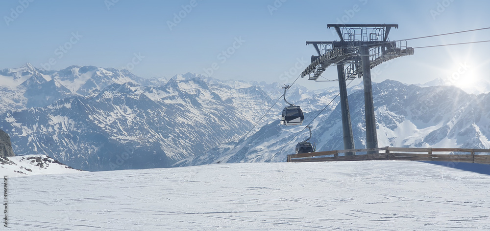 Beautiful sunny day at the ski resort.Empty ski resort with gondola and copy space Beautiful sunny day at the ski resort.Empty ski resort with gondola and copy space