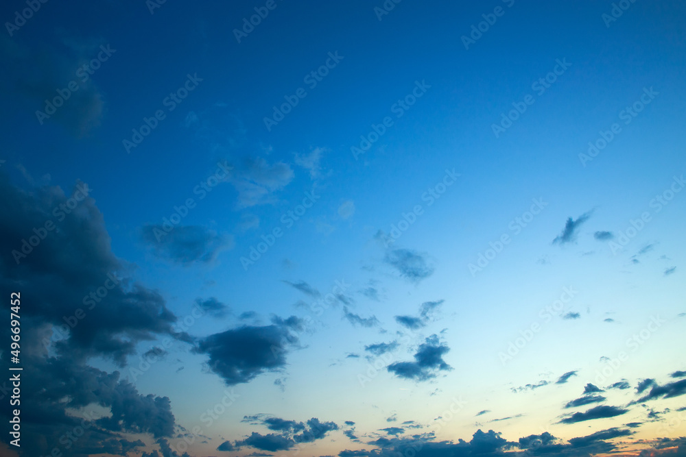 Fototapeta premium Romantic and idyllic sunset sky with colorful clouds, natural background of nature