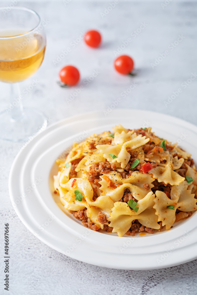 Minced beef tomato sauce pasta in a white plate Minced beef tomato sauce pasta in a white plate