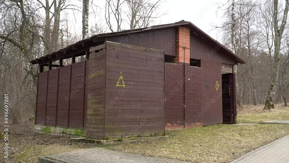 Old-fashioned USSR toilet architectural design sample in a landscaped Vintage environment in outdoors. A wooden board construction. Welcome back to the Soviet Union in Russia. Old-fashioned USSR toilet architectural design sample in a landscaped Vintage environment in outdoors. A wooden board construction. Welcome back to the Soviet Union in Russia.
