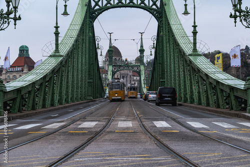 Historical trams are crossing Budapest freedom brigde