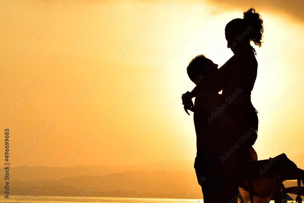 Couple in love, silhouette of a couple, at sunset with a very special landscape