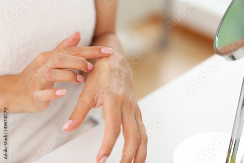 Beauty woman with moisturizer concept in the bathroom