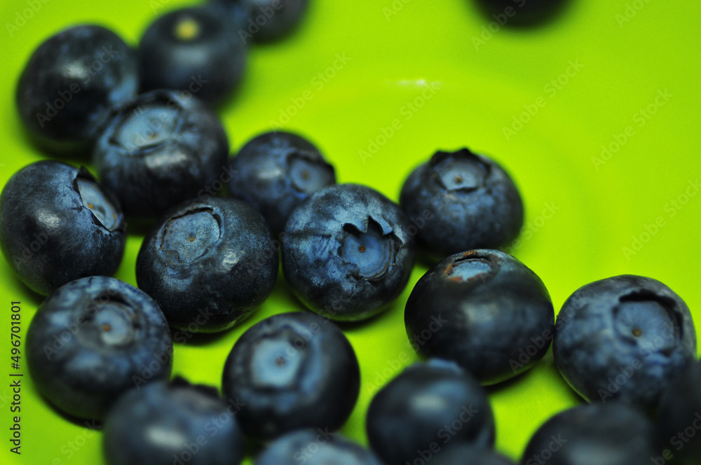 Blueberries on a plate on a white background. Signs. Healthy wholesome food. Vitamins and microelements. Blueberries on a plate on a white background. Signs. Healthy wholesome food. Vitamins and microelements.