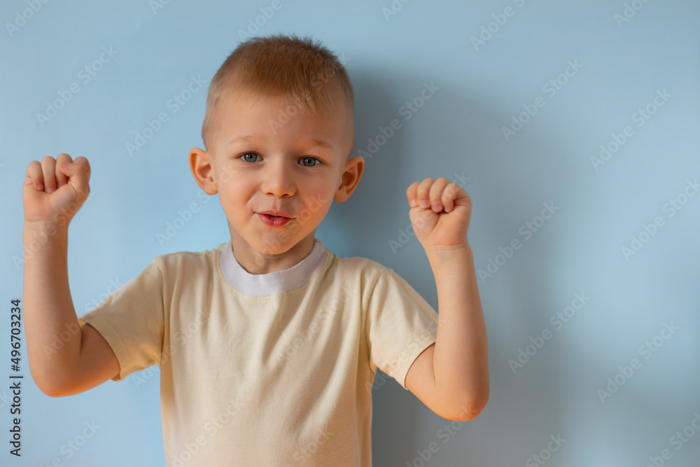 Portrait little smiling boy on blue studio background. Happy child kid. Copyspace mockup banner Portrait little smiling boy on blue studio background. Happy child kid. Copyspace mockup banner