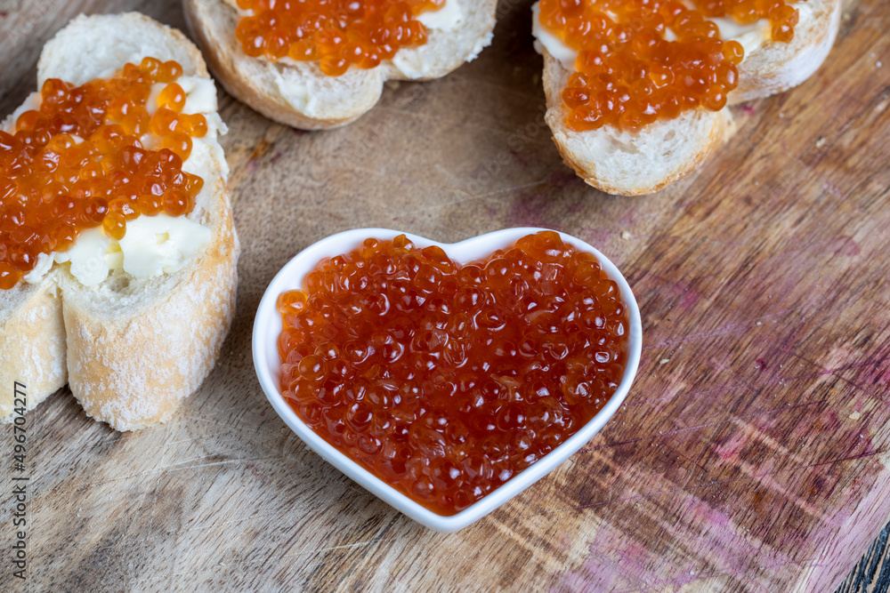 natural red salmon caviar with baguette and butter natural red salmon caviar with baguette and butter