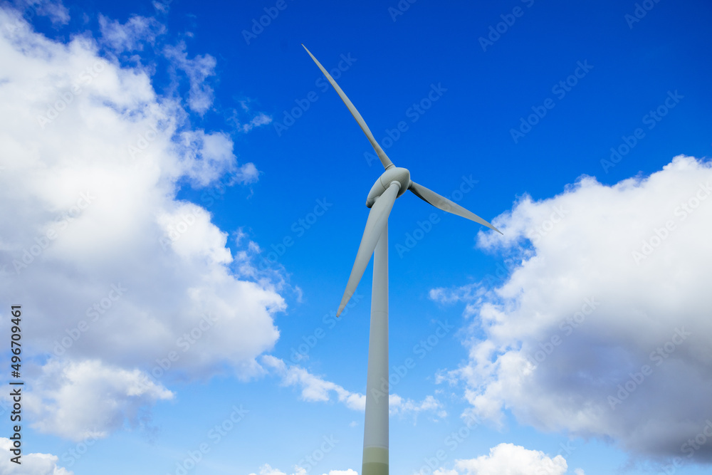 Wind turbine with blue sky as background. Energy transition in Germany. Green energy generated by wind Wind turbine with blue sky as background. Energy transition in Germany. Green energy generated by wind