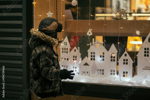 Photography A child looks at a cafe window