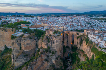 Canvas schilderij Ronda Puente Nuevo Zonsondergang boven Spaans stadje Ronda  © dudlajzov