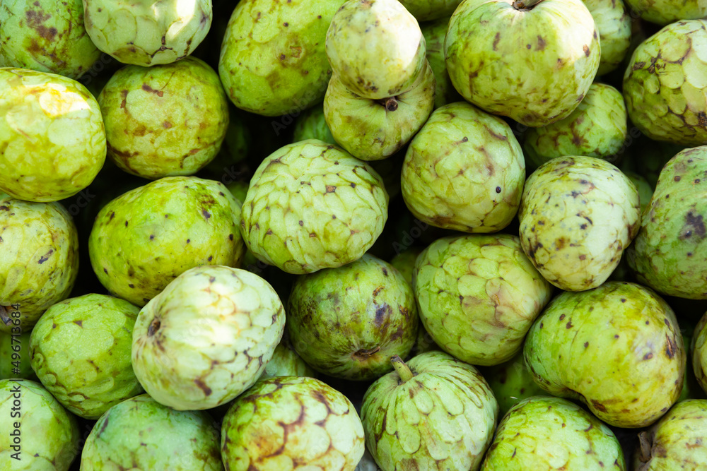 Fototapeta premium Fresh delicious cherimoya, put up for sale on the counter in the store