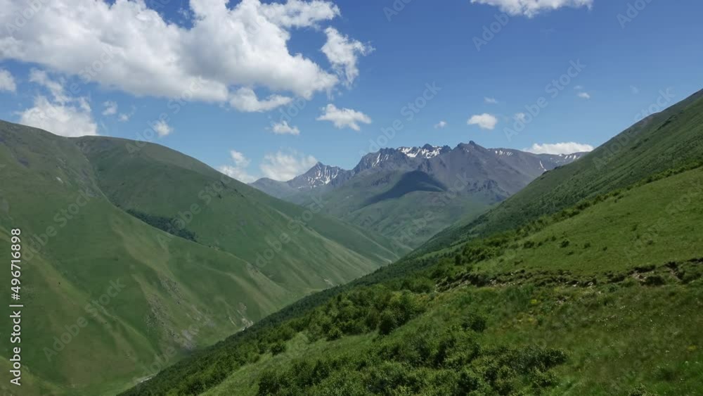 Beautiful summer landscape with fast moving clouds in Caucasus Mountains, Russia, zoom out timelapse 4k Beautiful summer landscape with fast moving clouds in Caucasus Mountains, Russia, zoom out timelapse 4k