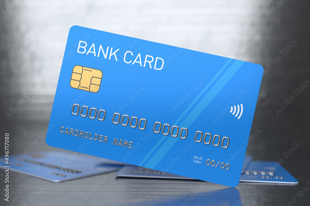 Blue plastic bank cards on a shiny metallic background. Banking and e-commerce concept. Credit card without branding, selected focus Blue plastic bank cards on a shiny metallic background. Banking and e-commerce concept. Credit card without branding, selected focus