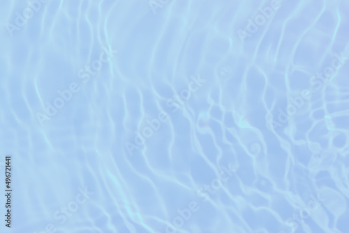 Blurred abstract background. Closeup of blue transparent clear calm water surface texture with splashes and bubbles. Trendy abstract summer nature background. for a product, advertising,text space