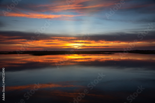 Sunset in Provincetown Causeway in Cape Cod with water reflection of the sky © rodphotography