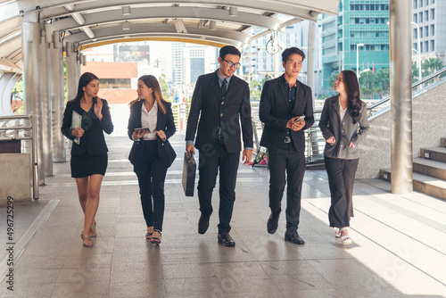 Crowd business people walking go to work in modern city life to working office. Crowd worker group of people busy life with businesswoman, man in urban street city lifestyle. Business People Concept.