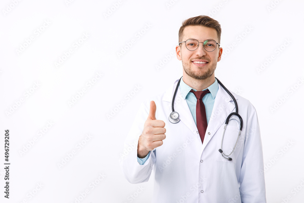 Portrait of confident young medical doctor on white background. The doctor shows the ok symbol Portrait of confident young medical doctor on white background. The doctor shows the ok symbol