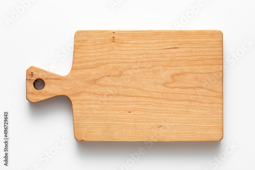 Cherry wood handmade wooden cutting board on white tabletop. Cherry wood texture. wooden cutting board isolated