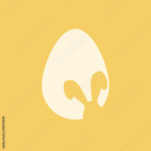 Jajko wielkanocne i królicze uszy na żółtym tle. Symbole świąt. Prosta ilustracja w minimalistycznym stylu na kartki świąteczne, zaproszenia, banery, plakat.
