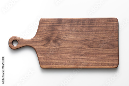 Foto Handmade black walnut wood cutting board on white background