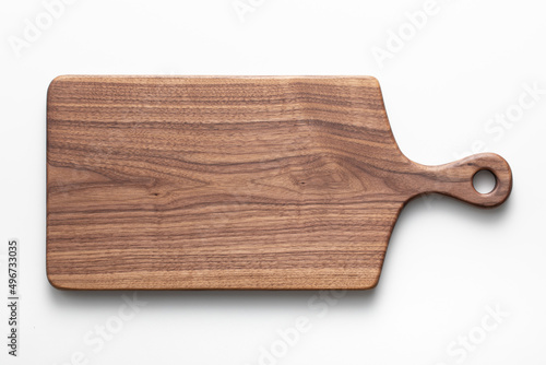 Fotografiet Handmade black walnut wood cutting board on white background
