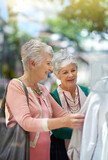 This is a great deal. Cropped shot of a two senior women out on a shopping spree.