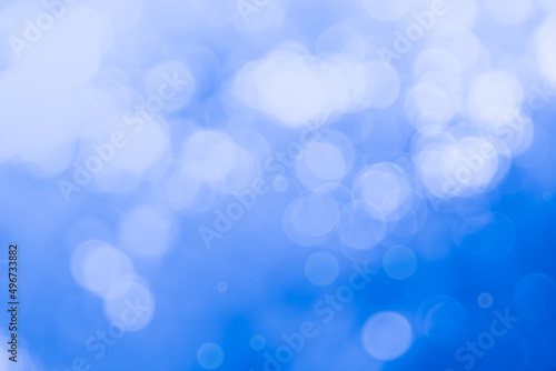 Abstract blurry blue color for background, Blur festival lights outdoor celebration and blue bokeh focus texture decorative.