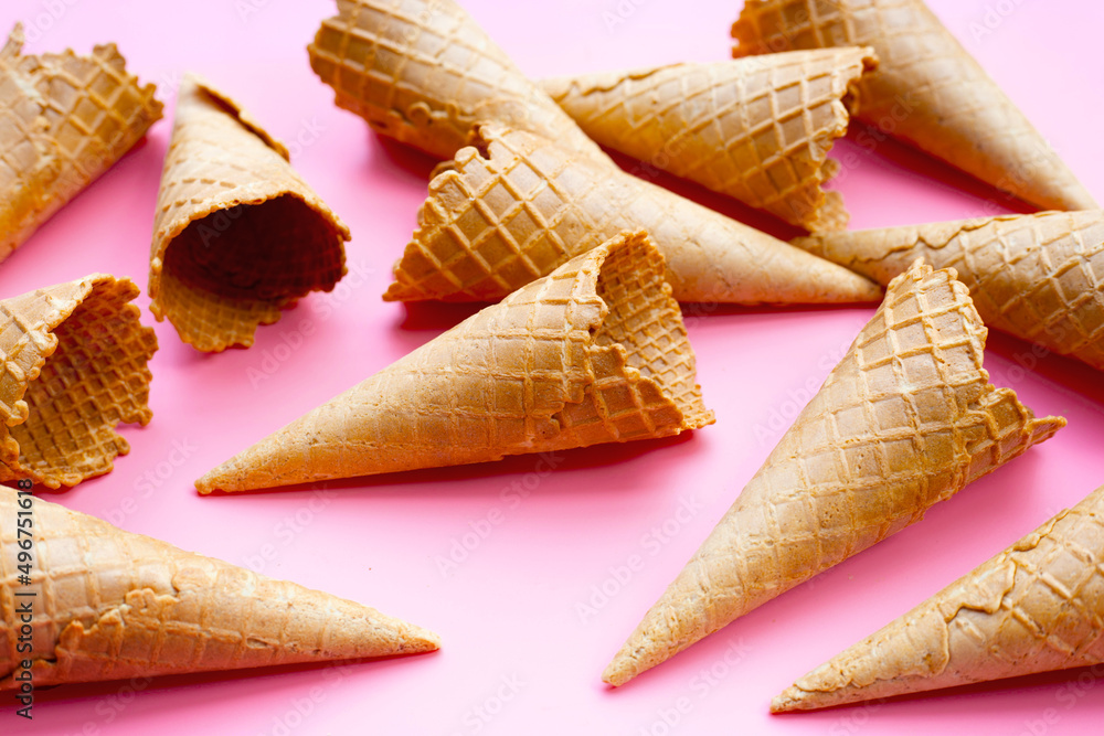 Empty ice cream cone on pink background. Empty ice cream cone on pink background.