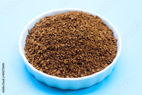 Instant coffee on blue background.