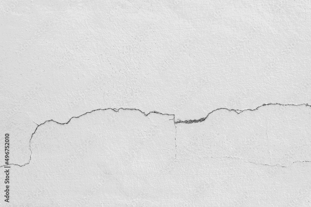 Obraz premium Grunge concrete cement wall with crack in industrial building texture background.