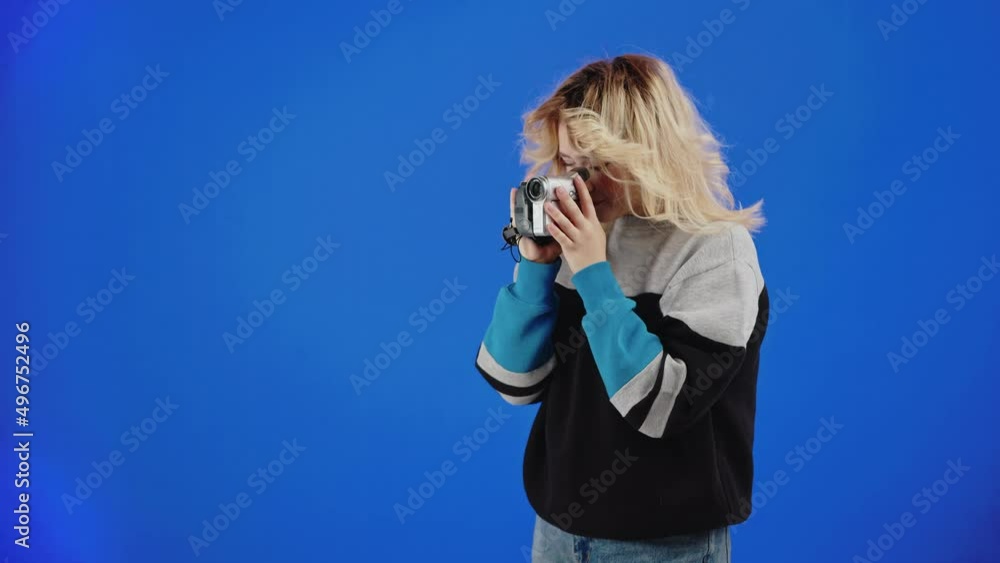 Female Loves Her Hobby — Recording Video With A Old Camcorder And Smiling.