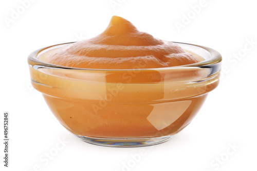 Glass bowl with apple puree isolated on white. photo