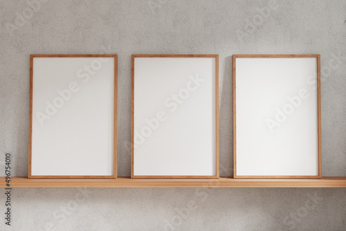 Three empty photo frame for mockup in empty white room. 3D rendering.