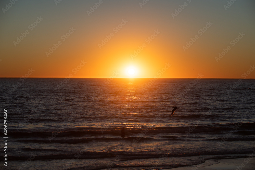 Calm ocean water. Golden sunrise sunset over the sea waves. Sunrise over the ocean.