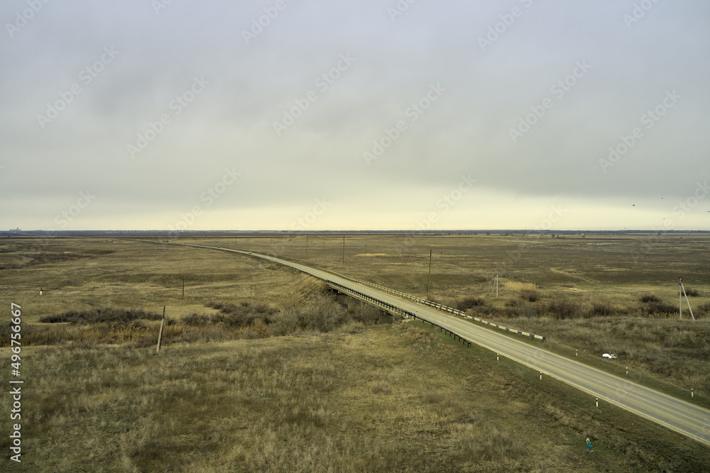 steppe plain landscape lake in the middle of fields