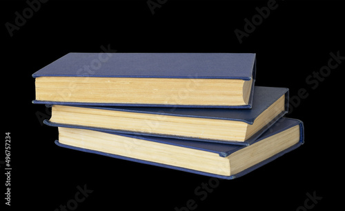 Stack of old books with blu...