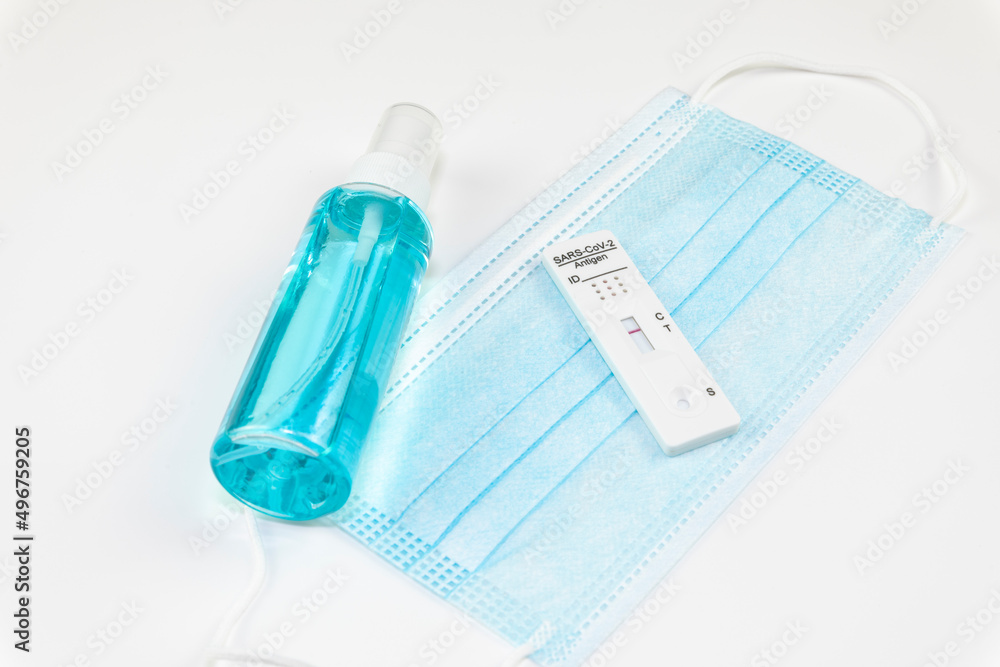 Covid-19 negative test result with SARS-CoV-2 Rapid antigen test kit (ATK) and protective surgical mask on white background. .Self testing for Coronavirus infectious protective. Covid-19 negative test result with SARS-CoV-2 Rapid antigen test kit (ATK) and protective surgical mask on white background. .Self testing for Coronavirus infectious protective.