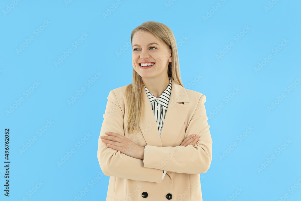 Concept of business with young attractive business woman on blue background Concept of business with young attractive business woman on blue background