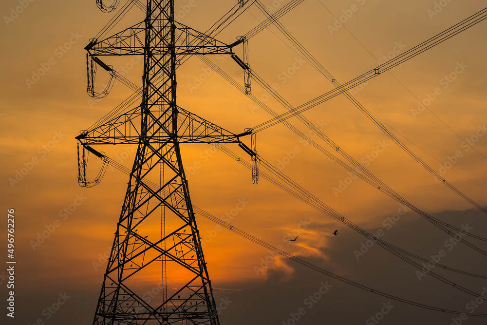high voltage post,High voltage tower sky sunset background.
